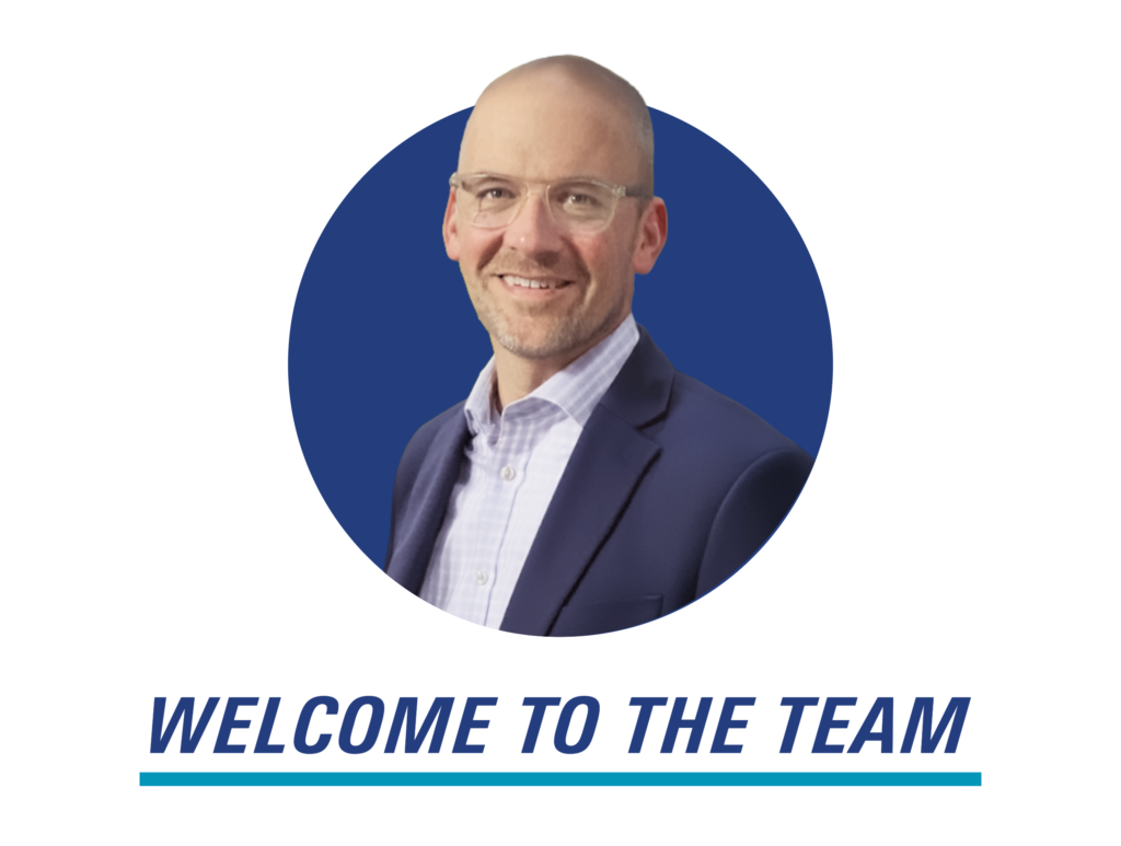 A professional headshot of Todd Hamilton in a blue circle